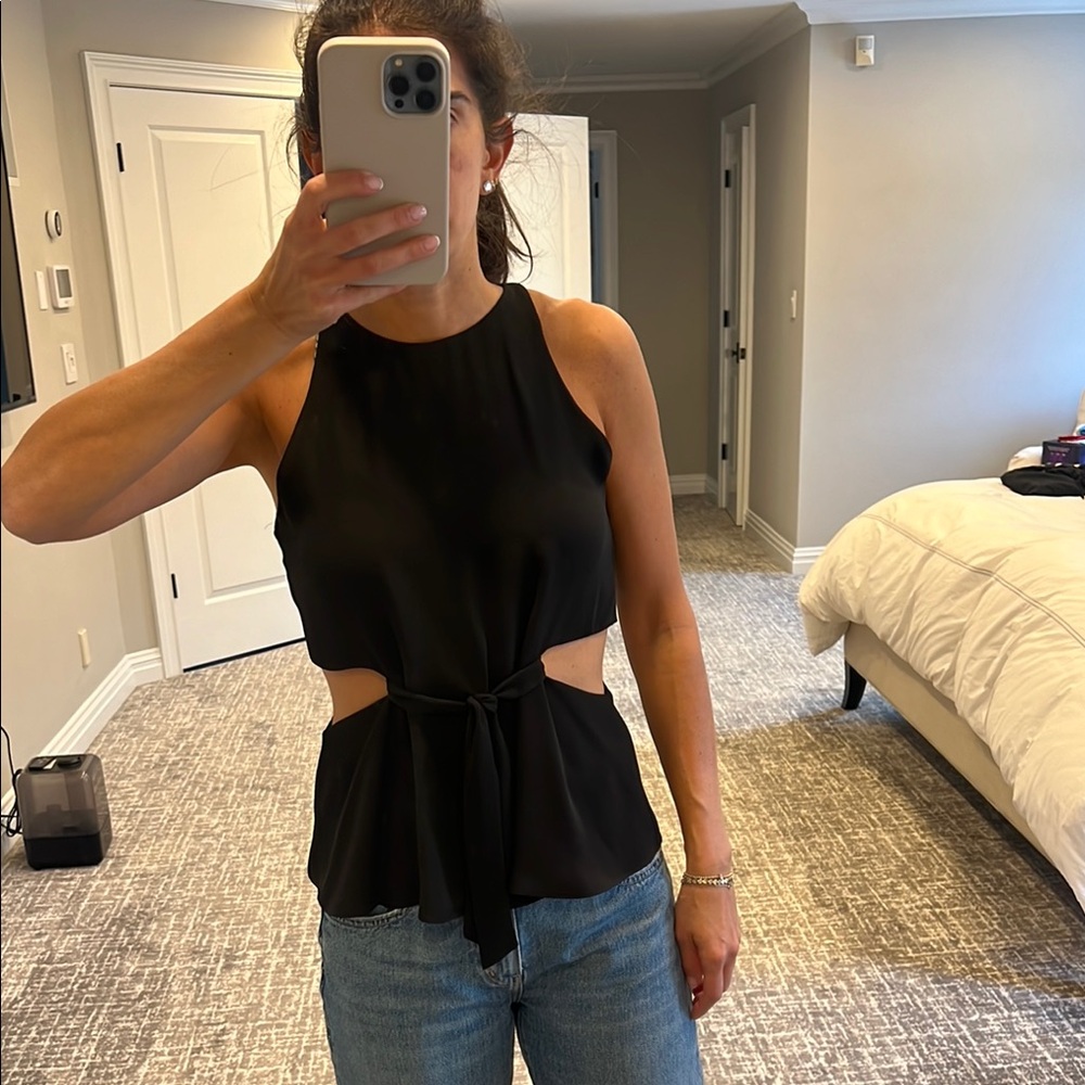 Black sleeveless tank top with mock neck and tie front features
